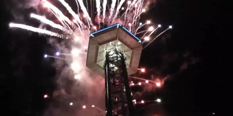 fireworks being shot off from the gatlinburg space needle on new years